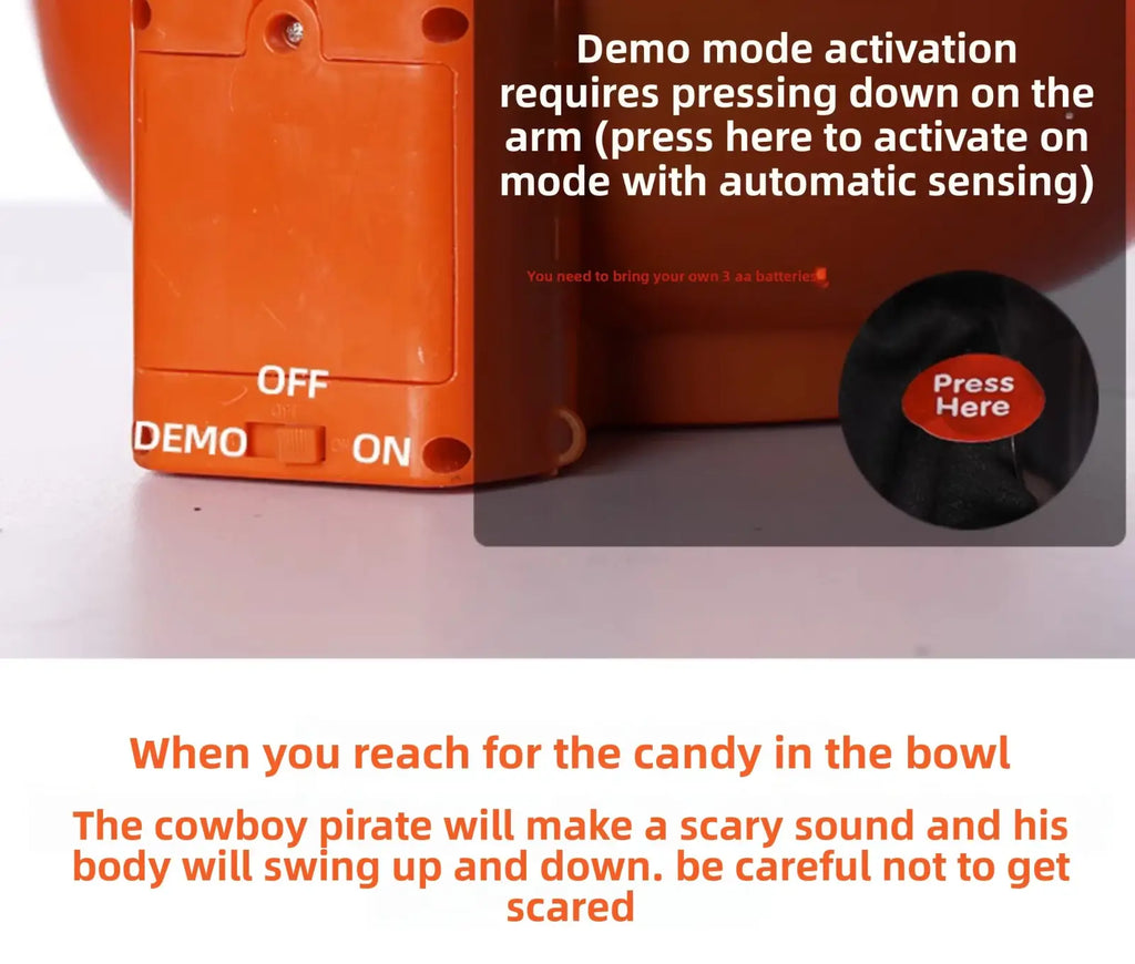 Back of orange plastic halloween skeleton candy bowl with demo switch and activation instructions for pirate decoration