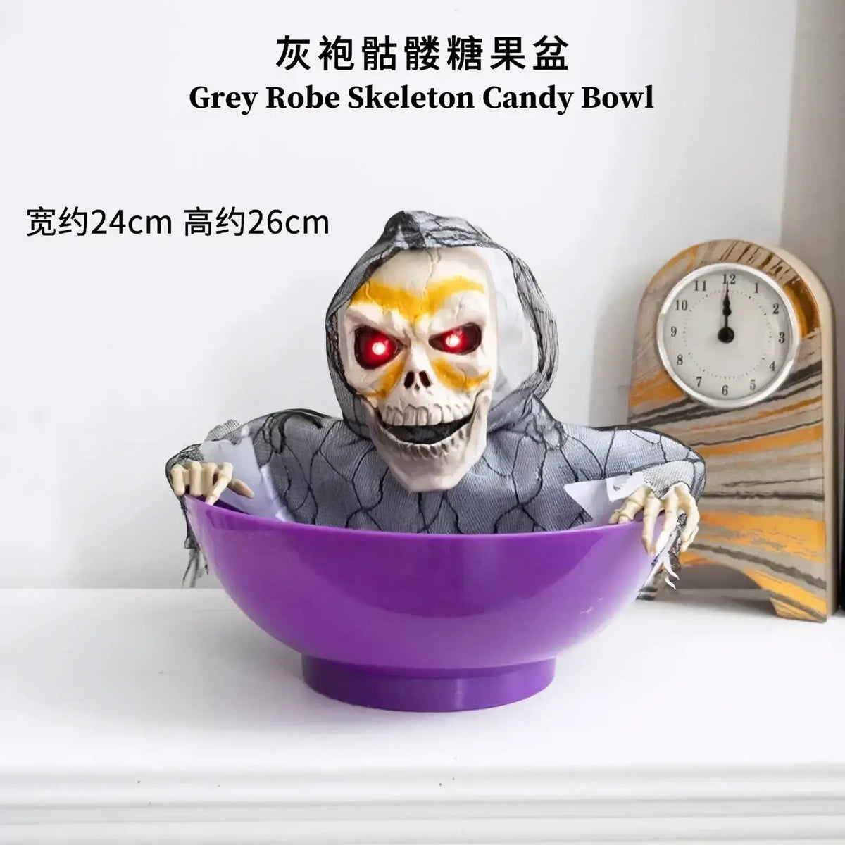 Purple plastic skeleton candy bowl with spooky grey-robed skeleton figure and glowing red eyes for halloween decor