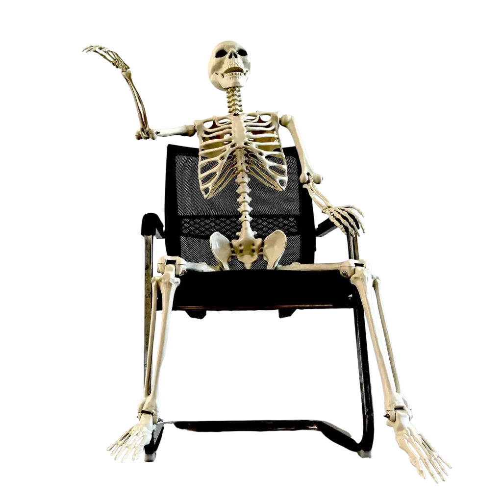 Off-white plastic halloween skeleton posable garden decor seated in black mesh office chair for haunted house use