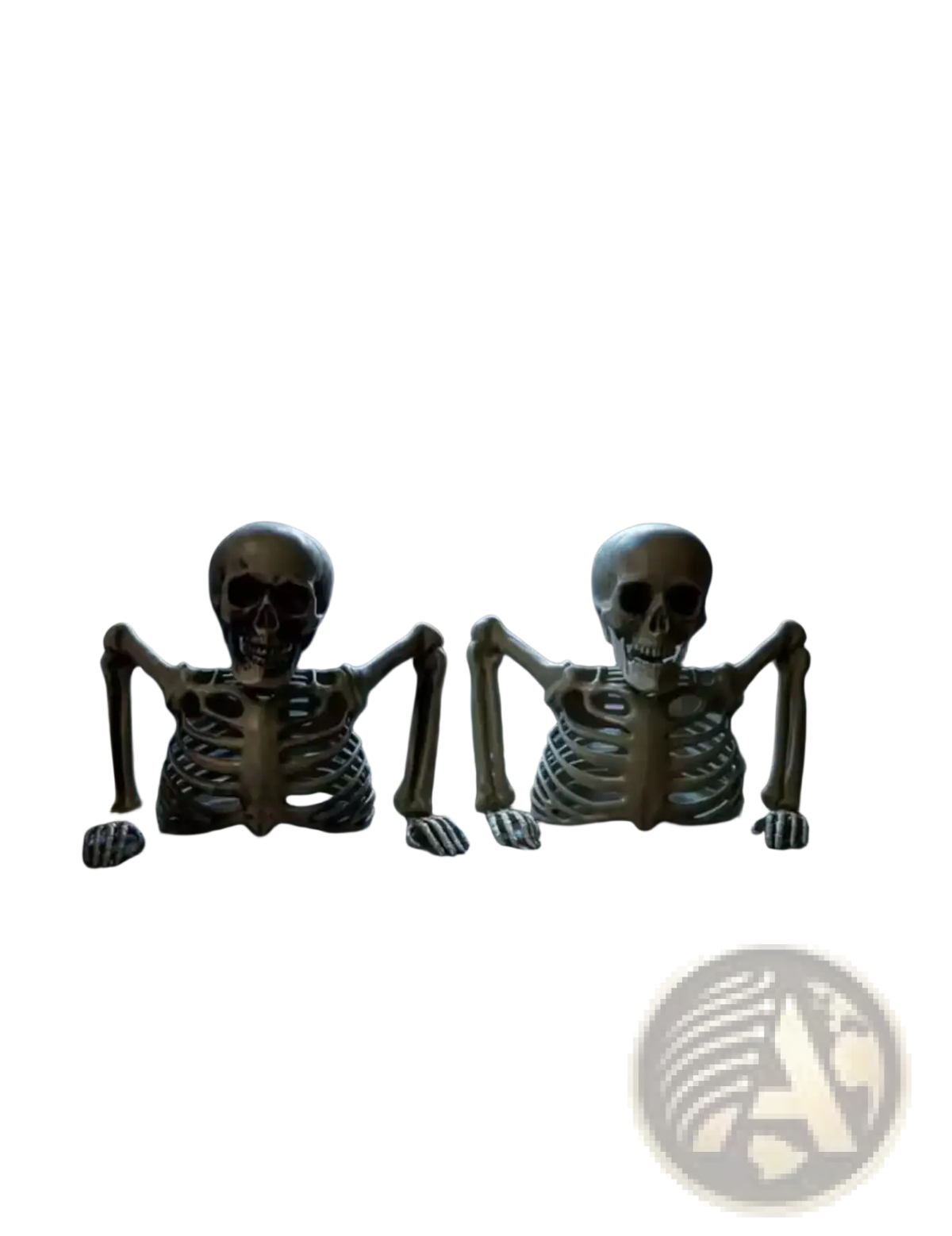 Two beige plastic skeleton props with articulated limbs sit on a stone windowsill for halloween indoor outdoor decor