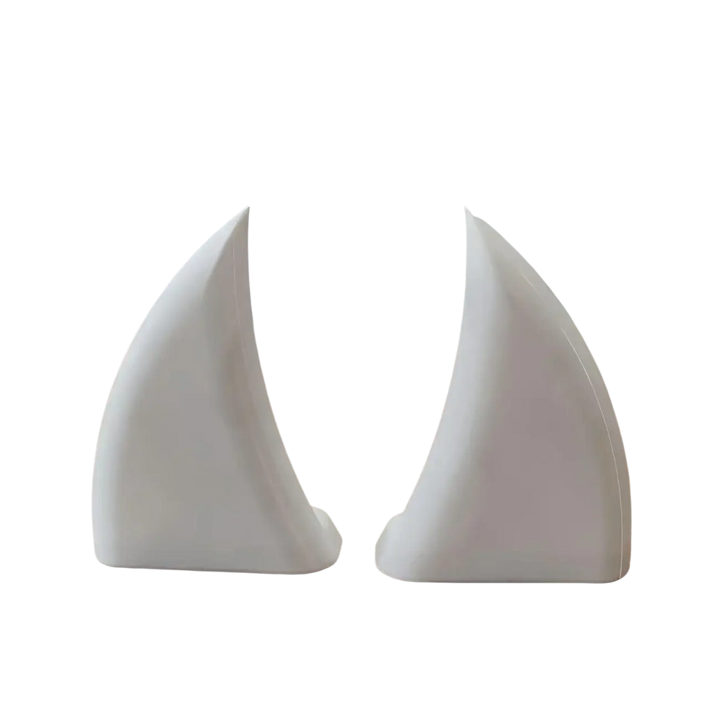 White ceramic sailboat-shaped bookends with glossy smooth surfaces and minimalist design for stylish decor