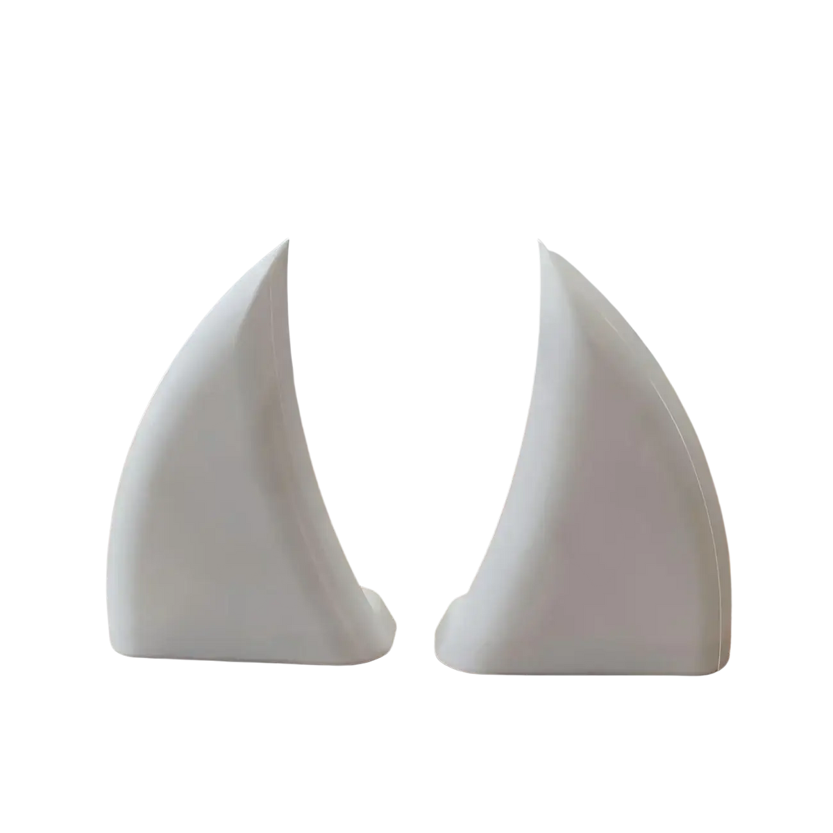 White ceramic sailboat-shaped bookends with glossy smooth surfaces and minimalist design for stylish decor