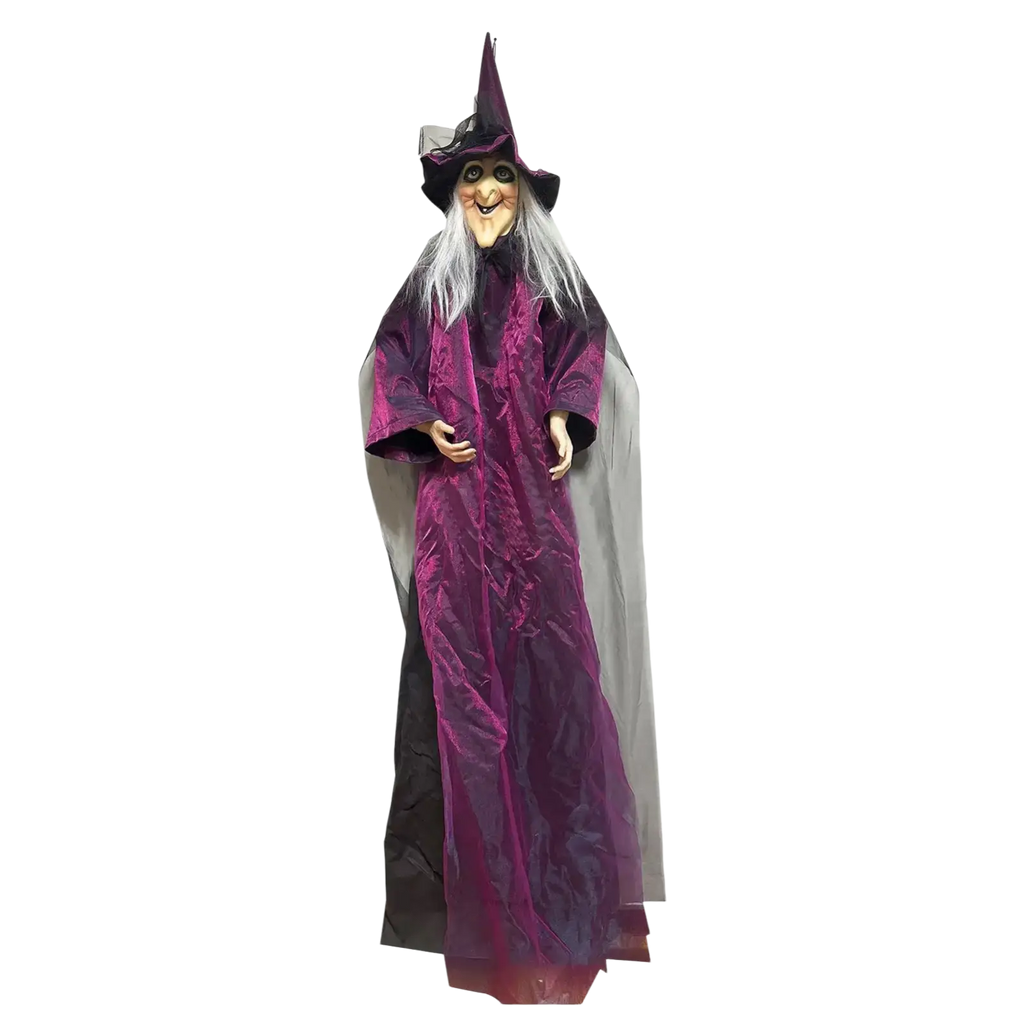 A 21-inch tall halloween witch decoration dressed in a purple velvet robe with black accents and a matching pointed hat