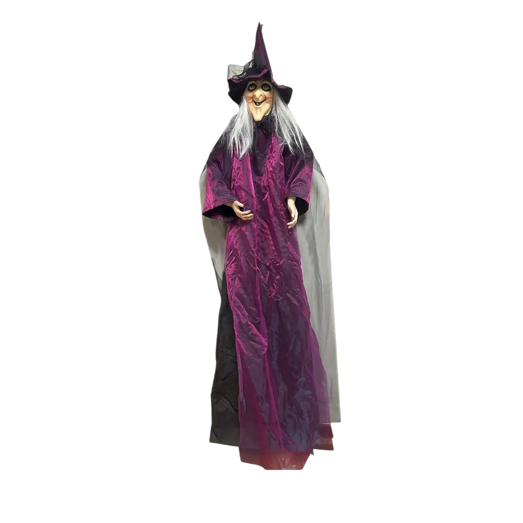 A tall animated halloween witch decoration in a flowing purple robe with glowing jack o lanterns outdoors