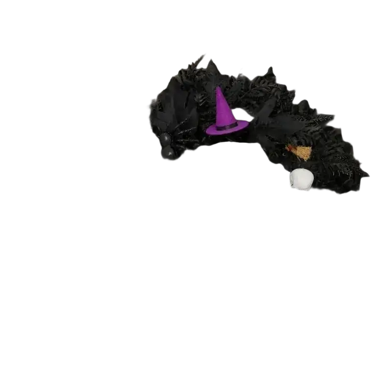 Black halloween wreath featuring a purple witch hat, orange pumpkin, white skulls, and a purple rose decoration