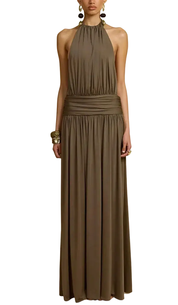 A flowing olive green halter-neck pleated maxi dress with a draped waistband for elegant evening party wear