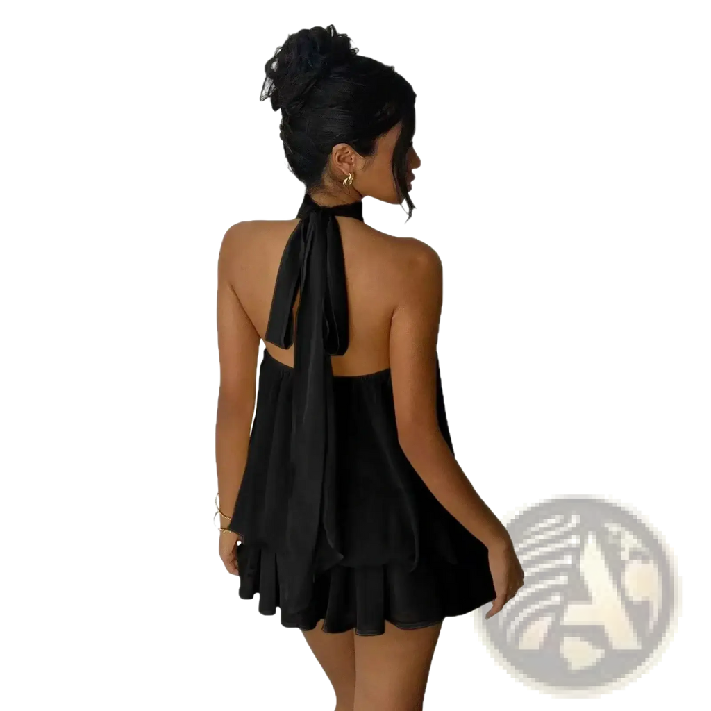 Black halter-neck mini dress with flowing back tie and ruffled hem designed for summer beachwear