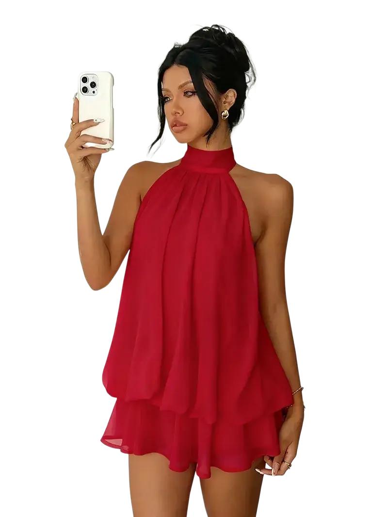 A vibrant red sleeveless halter neck mini dress with a layered ruffle skirt made of lightweight fabric for summer beachwear