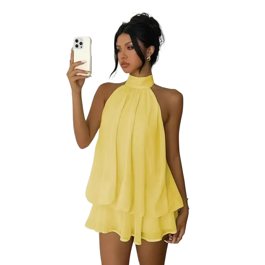 A vibrant yellow halter ruffle mini dress made of flowing chiffon fabric perfect for summer beachwear