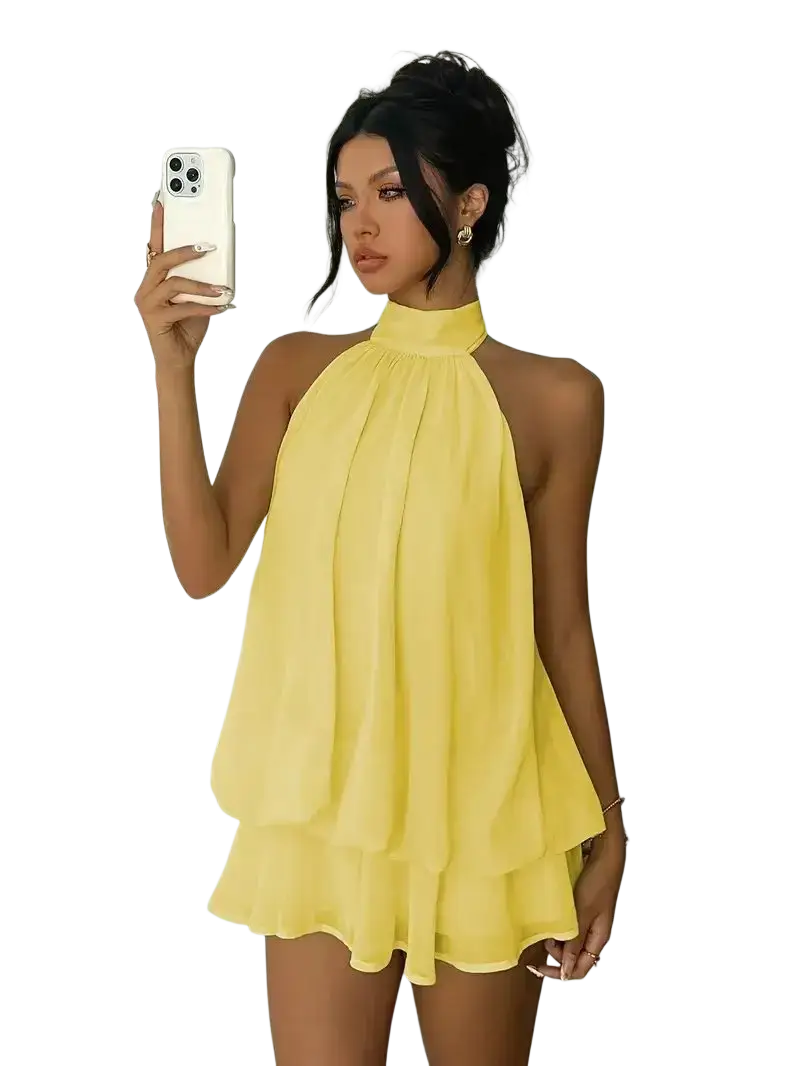 A vibrant yellow halter ruffle mini dress with a flowing layered design for summer beachwear