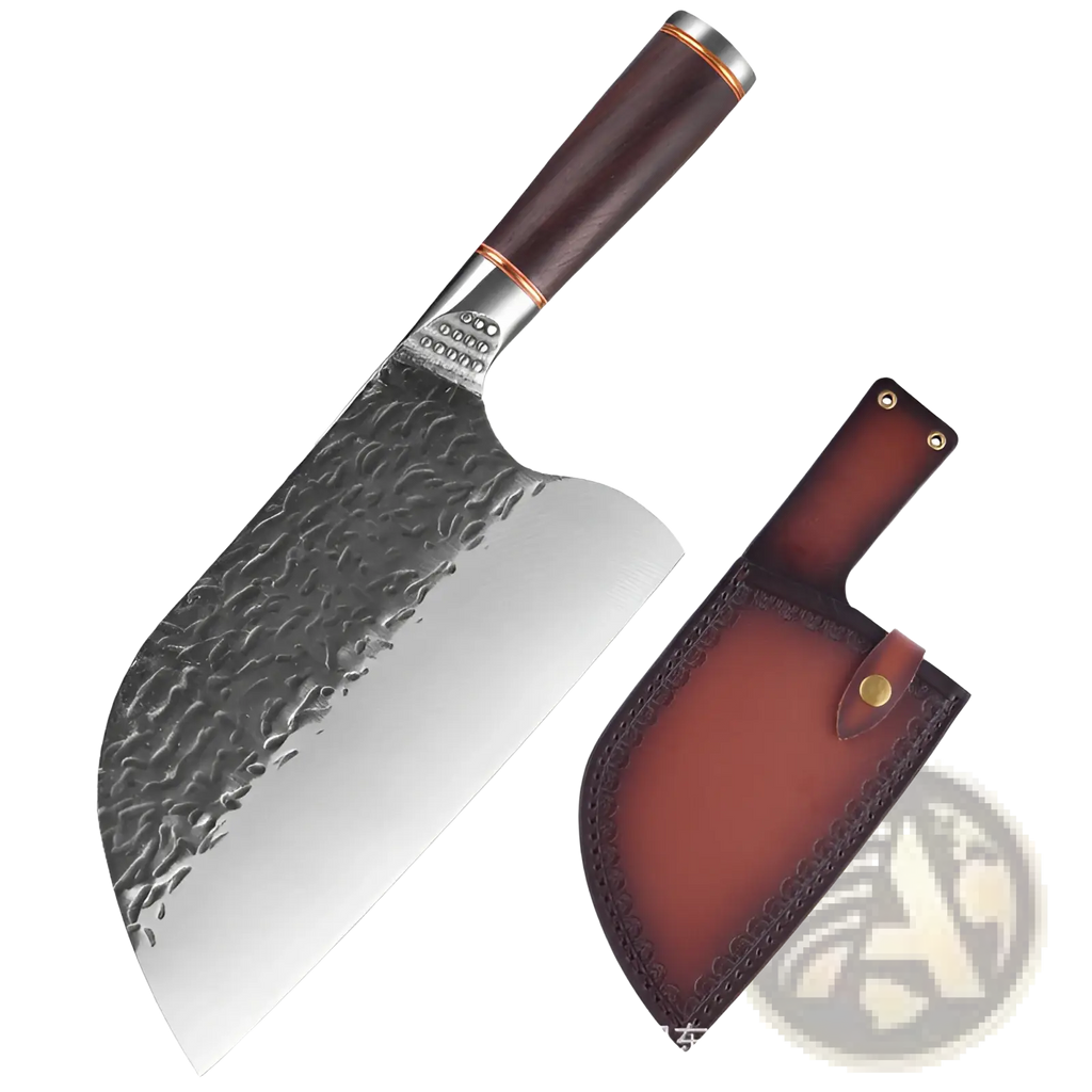 A hammered stainless steel cleaver with a dark brown wooden handle and copper accents beside its leather sheath
