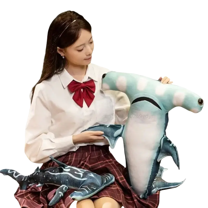 Soft teal and white plush hammerhead shark stuffed toy with black accents made of pillow soft material