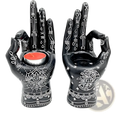Black ceramic hamsa hand incense burner and candle holder figurine with intricate white henna style patterns and symbols