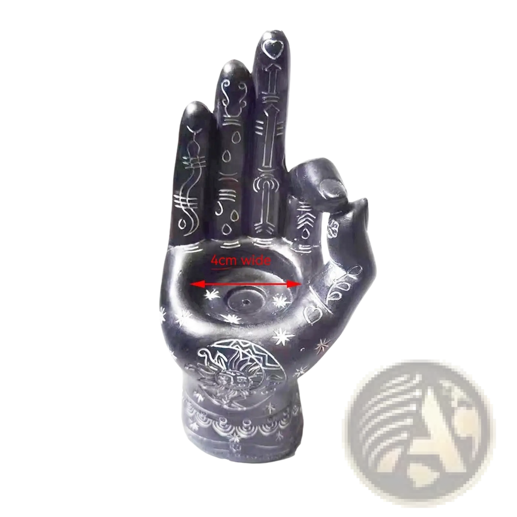 Black hamsa hand incense burner and candle holder figurine with intricate white etched patterns and symbols
