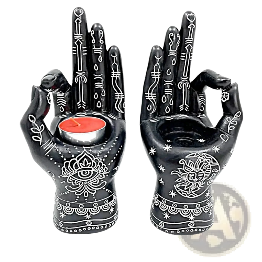 Black ceramic Hamsa hand incense burner and candle holder with intricate white henna designs holding a red tea light