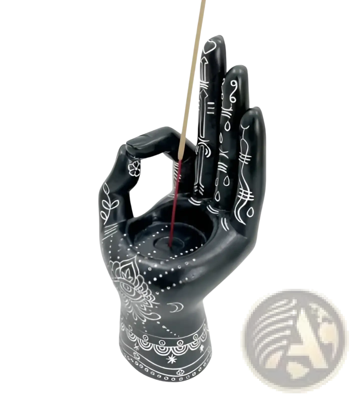 Black hamsa hand incense burner with intricate white floral patterns and central circular indentation for incense stick