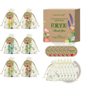 Clear organza gift bags with gold foil leaf pattern and drawstring closures holding hand cream and lip balm sets