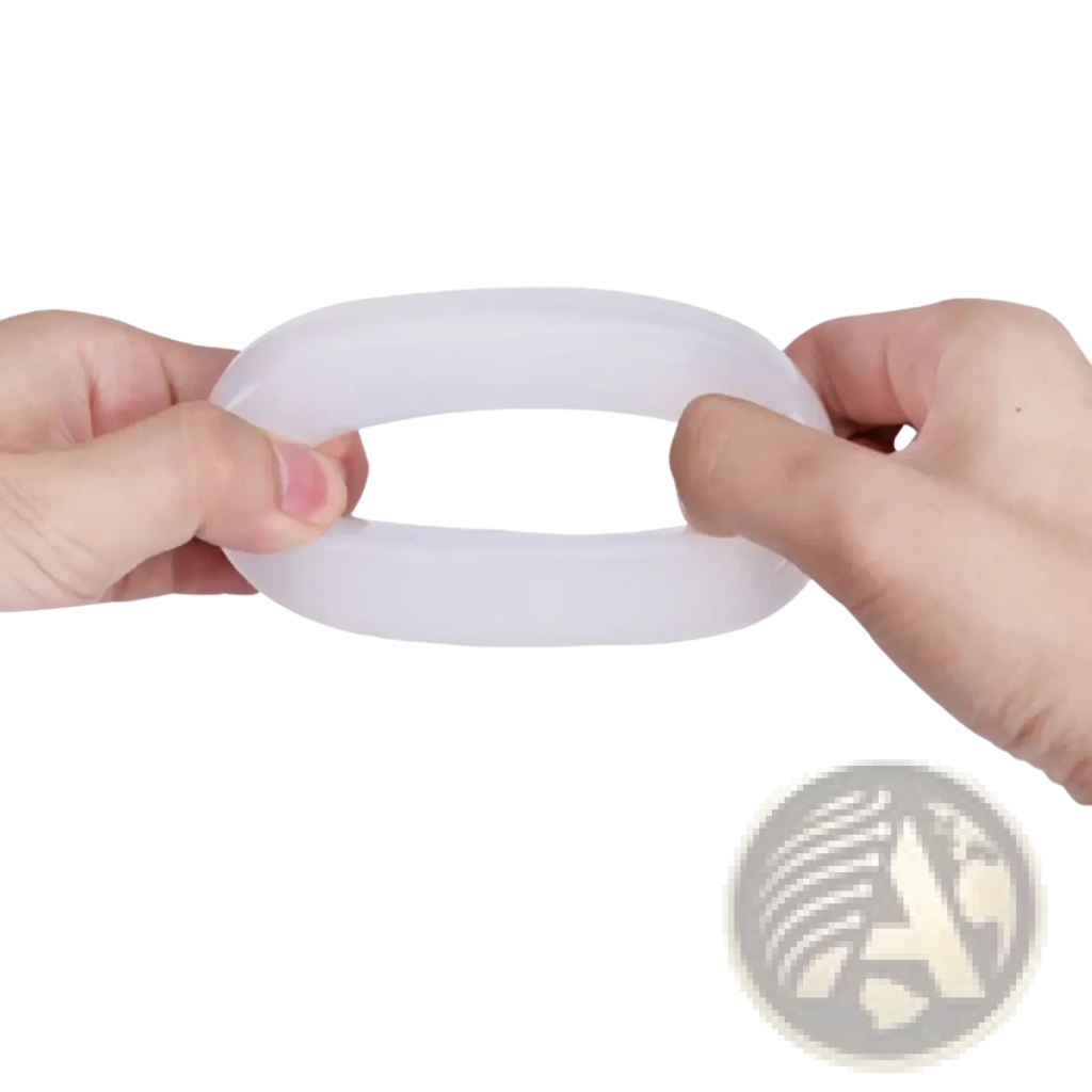A translucent white elastic hand grip strength ring being stretched by two hands for wrist training