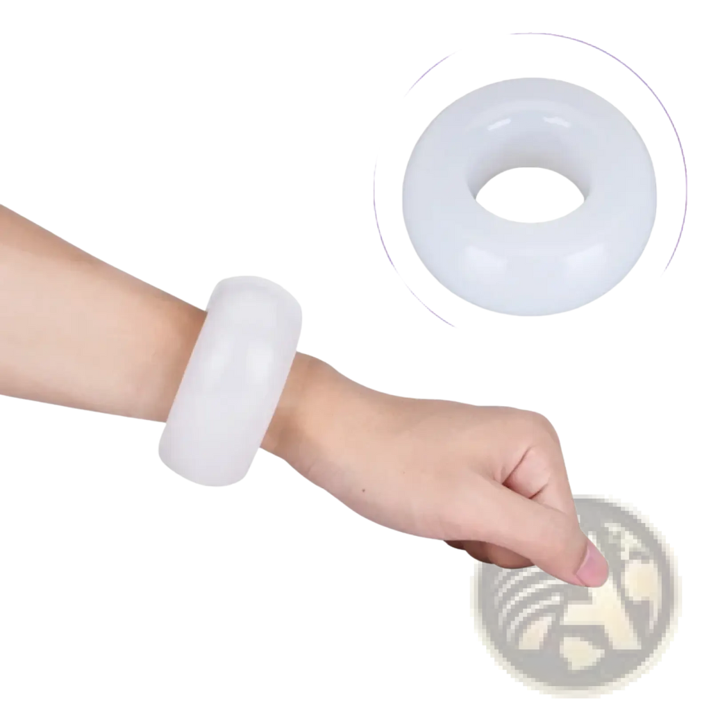 White smooth circular hand grip strength ring wrist trainer worn on a hand for grip and wrist strengthening
