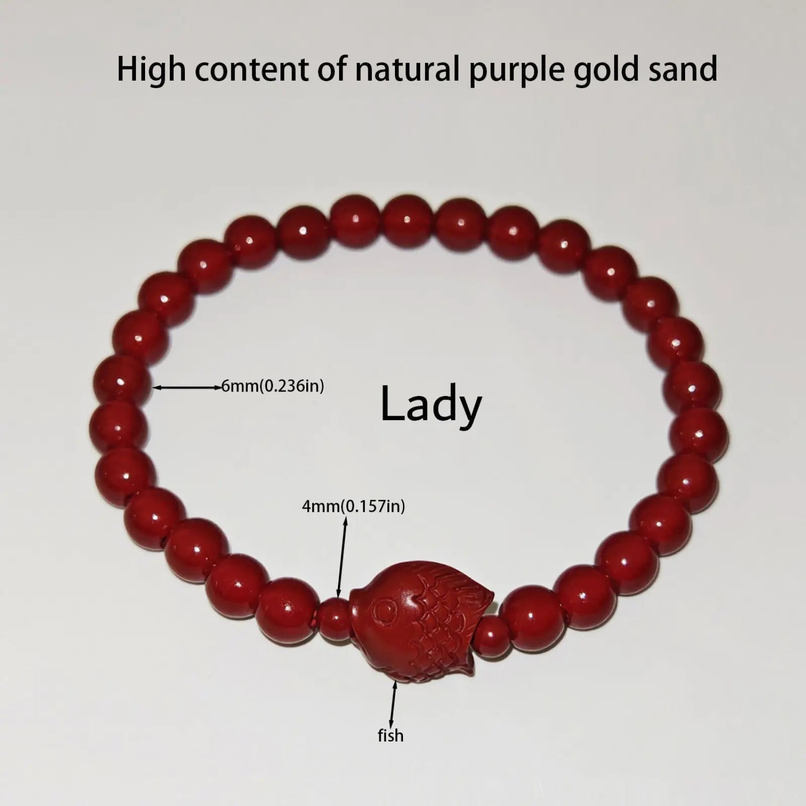 Handcrafted cinnabar lotus and calabash red beaded bracelet featuring a carved fish charm made from natural purple gold sand