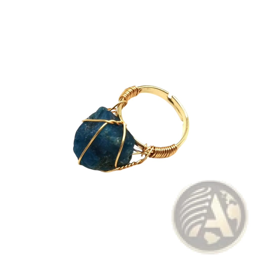 Handcrafted adjustable gold wire wrapped ring featuring a raw deep blue gemstone centerpiece