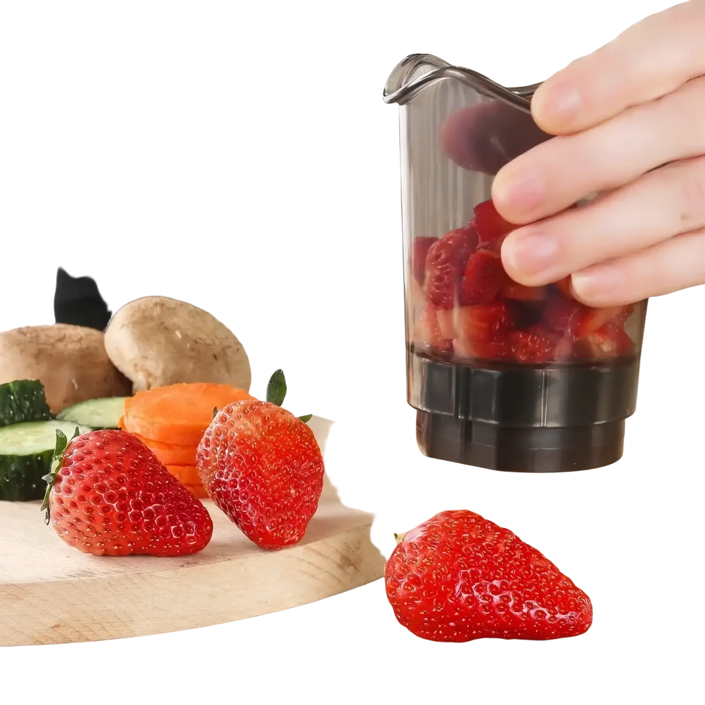 Transparent plastic container with black base handheld fruit and vegetable chopper filled with chopped strawberries