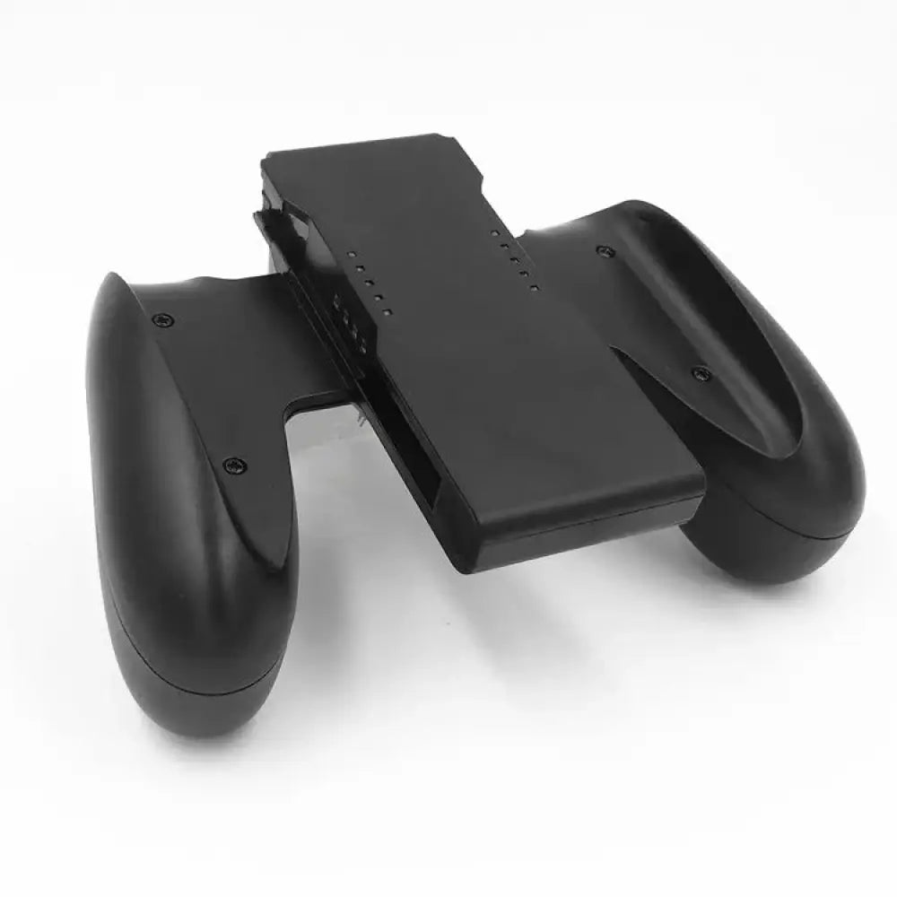 Black plastic Nintendo Switch joy-con grip holder with ergonomic handles and central charging slot for tablet keyboard case