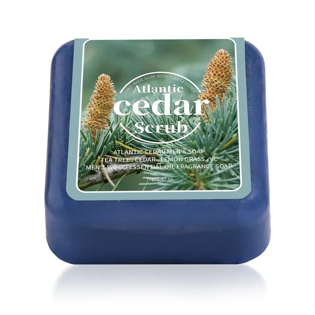 Deep blue handmade soap bar of atlantic cedar scrub men’s soap with nature-themed label featuring pine cones and needles