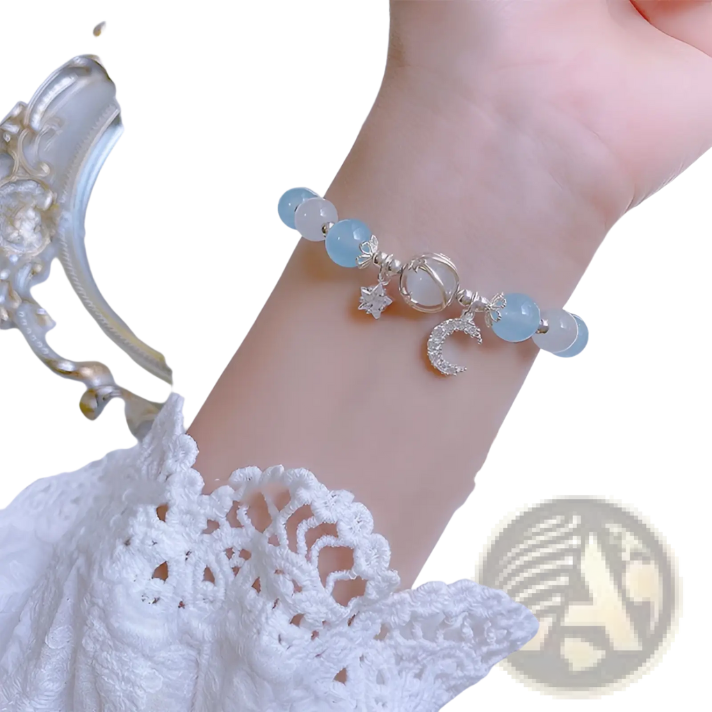 Handmade celestial moon and star crystal bead bracelet with delicate light blue jade beads and silver charms