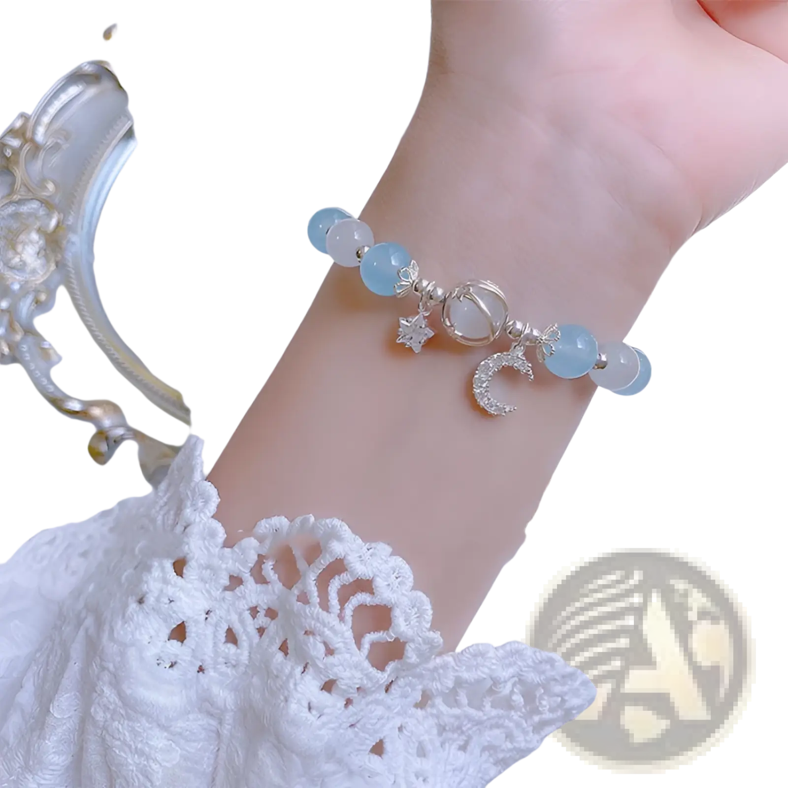Handmade celestial moon and star crystal bead bracelet with delicate light blue jade beads and silver charms