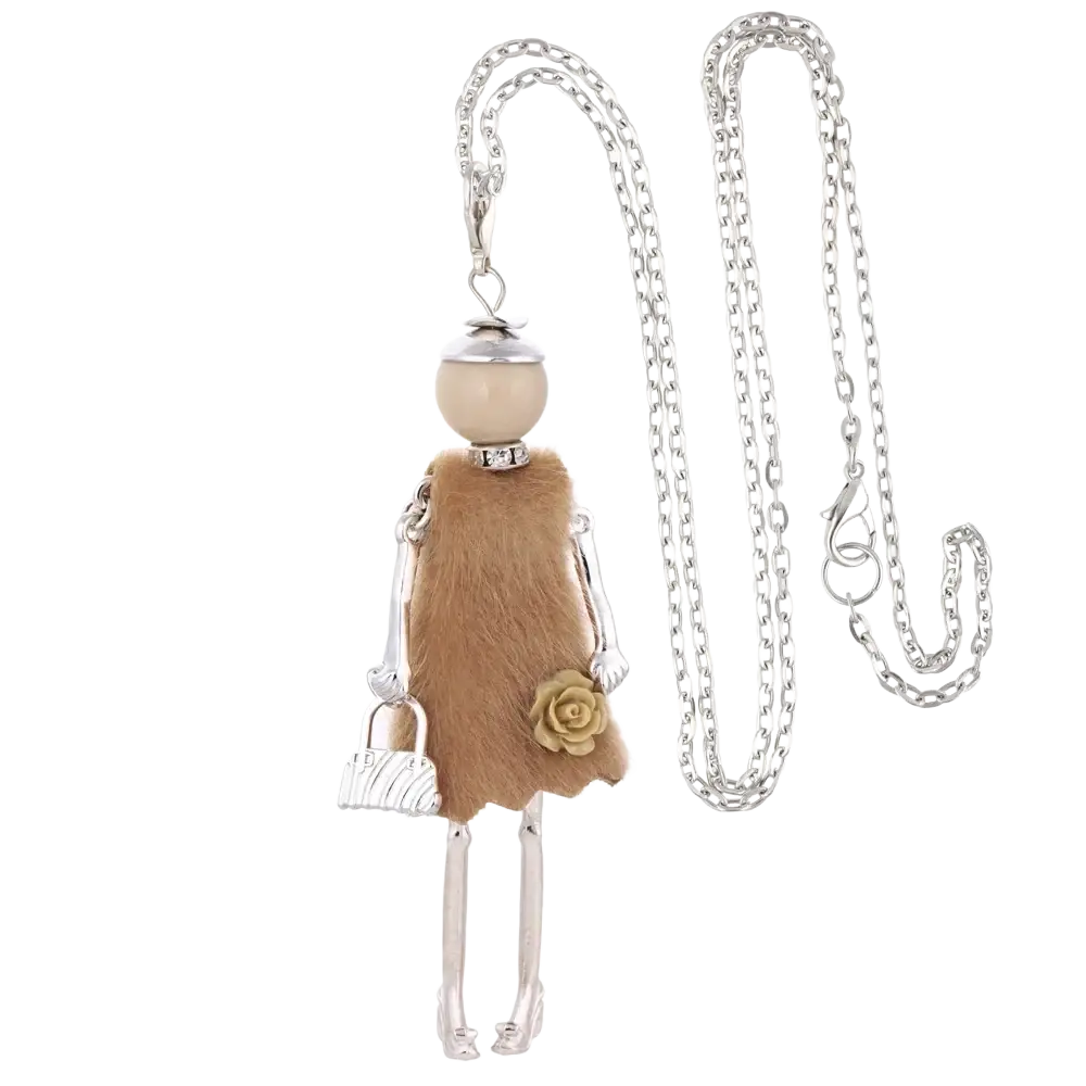 A silver chain necklace with a handmade vintage pendant featuring a beige pearl head and tan faux fur doll