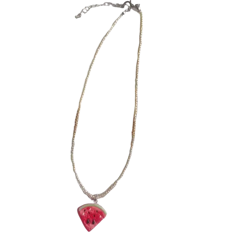 Handmade pendant necklace featuring creamy white pearl beads and a vibrant red watermelon slice charm