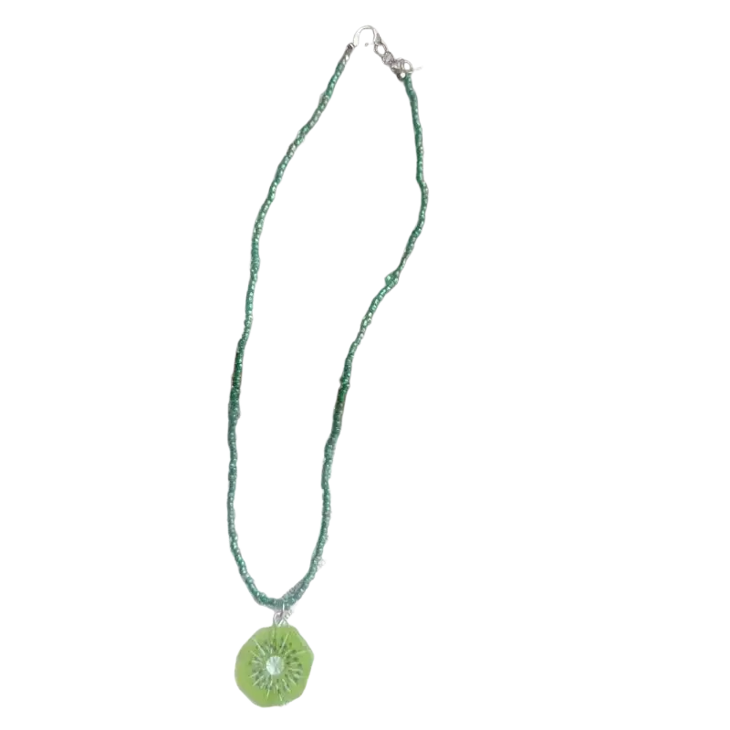 Handmade green beaded pendant necklace featuring a delicate bohemian kiwi slice pendant with a sparkling center