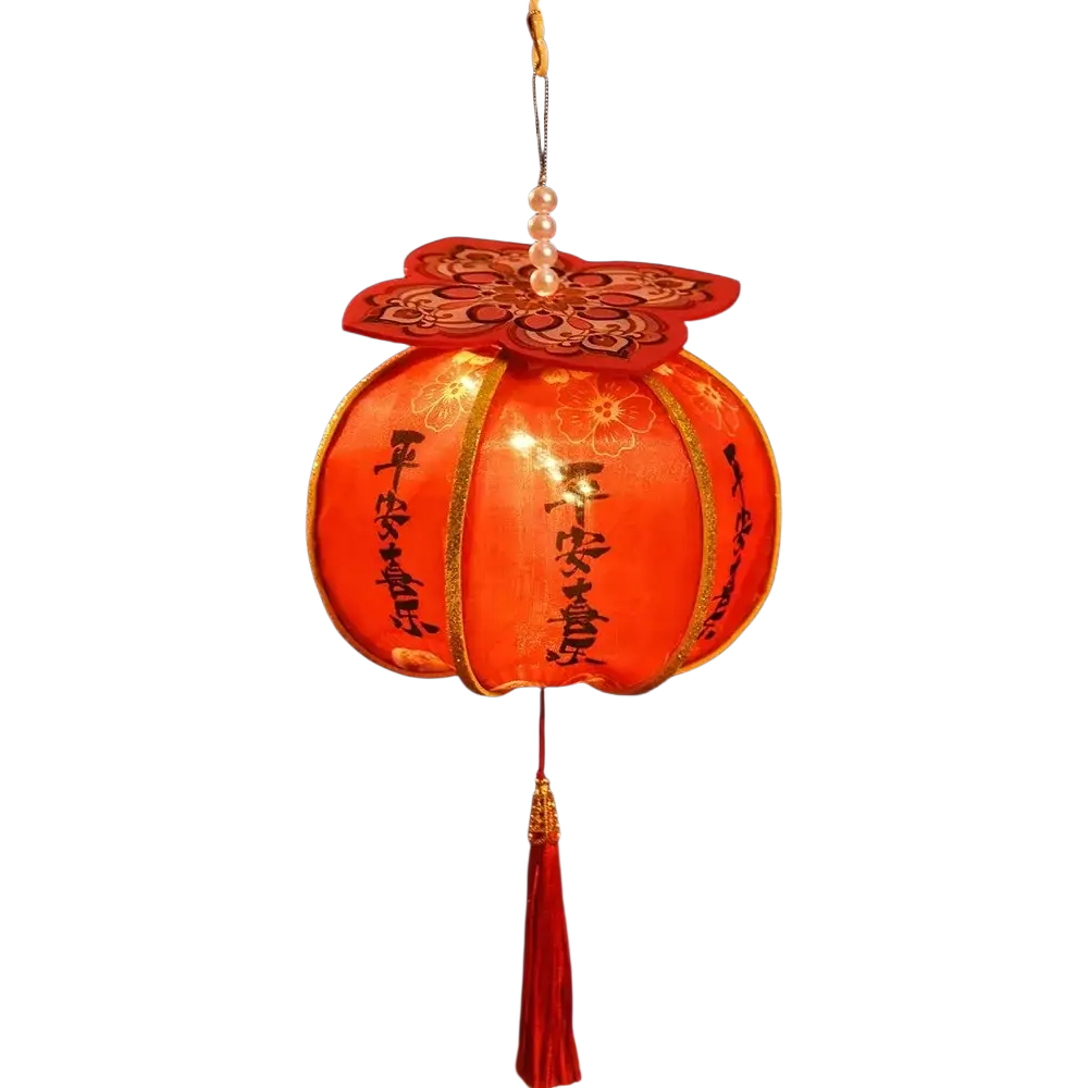 A handmade persimmon Chinese New Year lantern in glowing red with gold trim, embroidered flowers, and pearl decorations