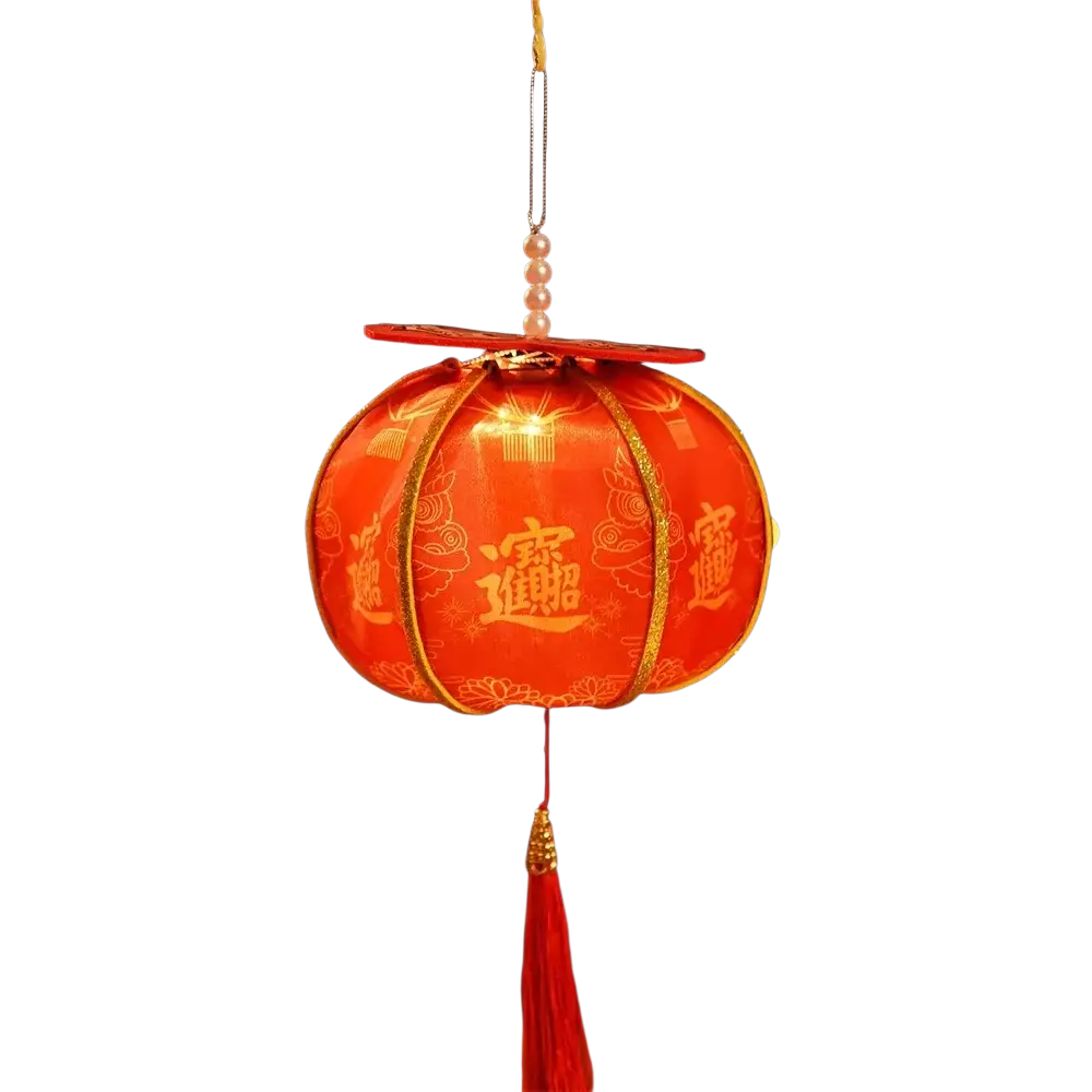 A handmade persimmon Chinese New Year lantern featuring a glowing red paper body, gold embroidery, and pearl-adorned tassel