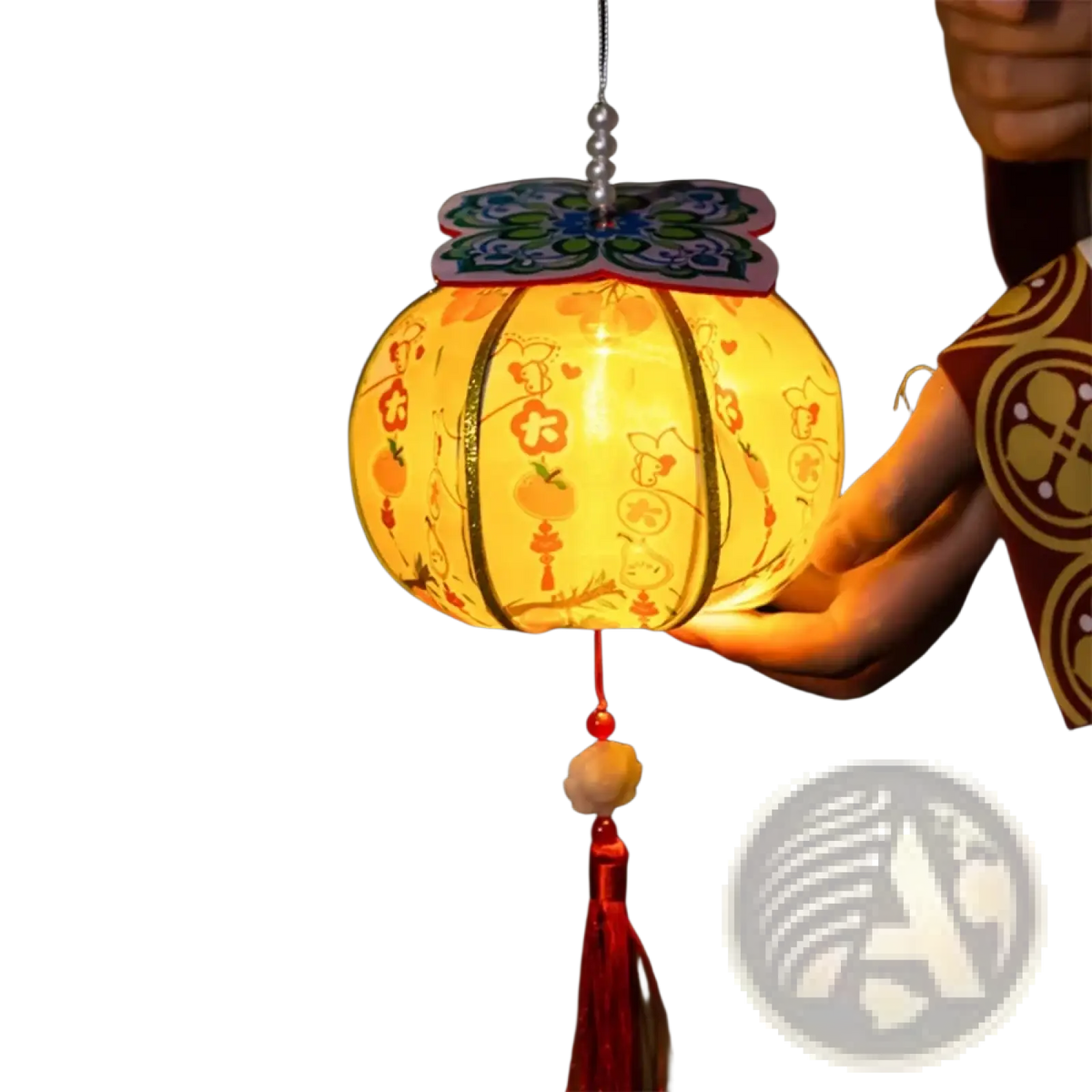 A handmade persimmon paper lantern glowing yellow with intricate orange and blue floral patterns and butterfly top