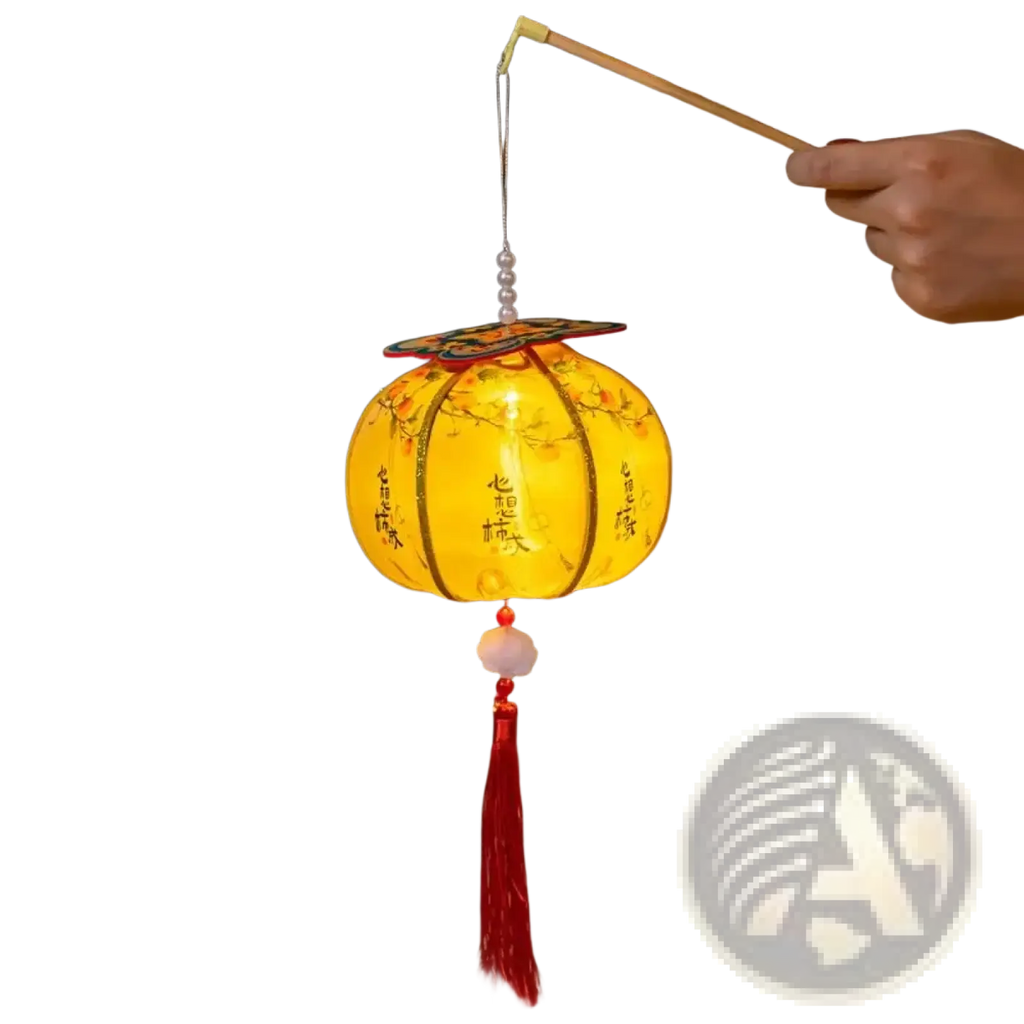 A glowing yellow handmade persimmon Chinese New Year lantern with floral designs, Chinese characters, red tassel, and pearls