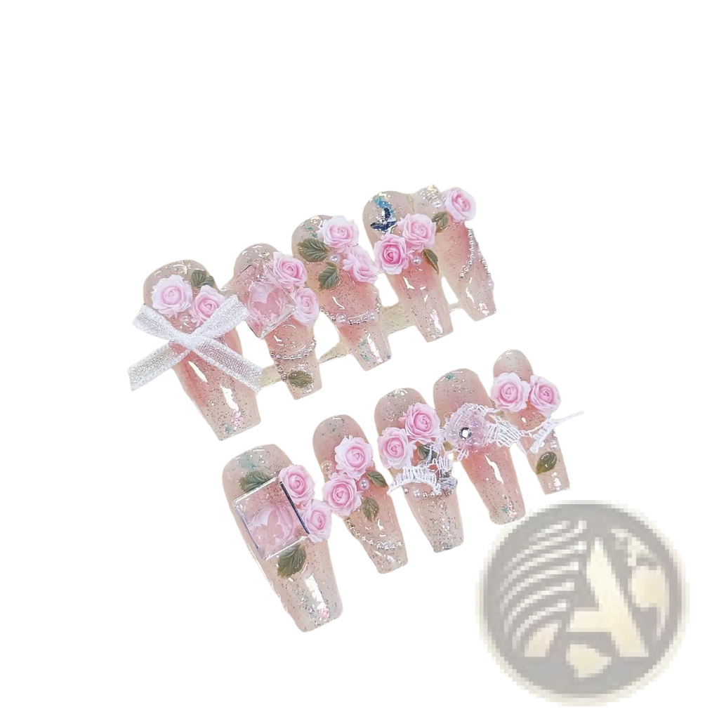 Handmade pink floral almond press on nails with glitter featuring delicate rose embellishments and lace details