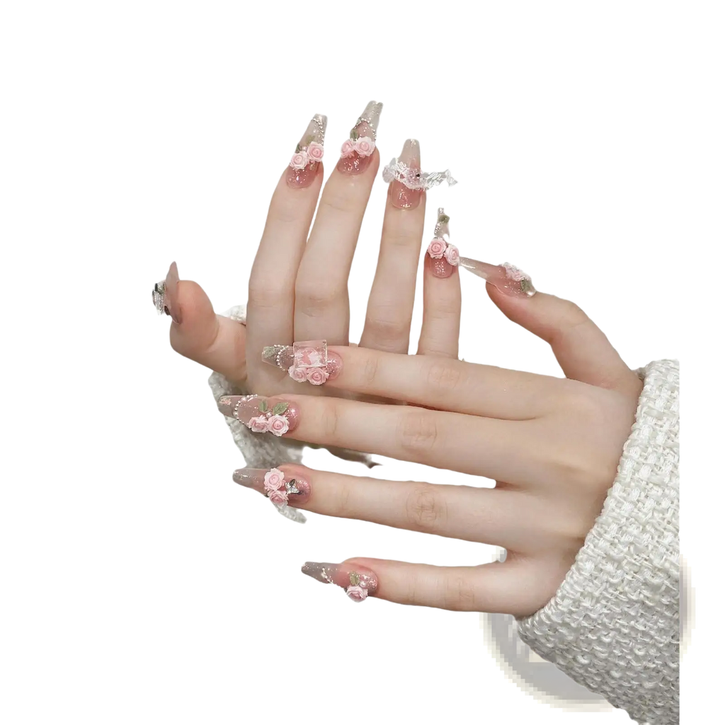 Handmade pink floral almond press on nails featuring delicate floral embellishments and glittery accents