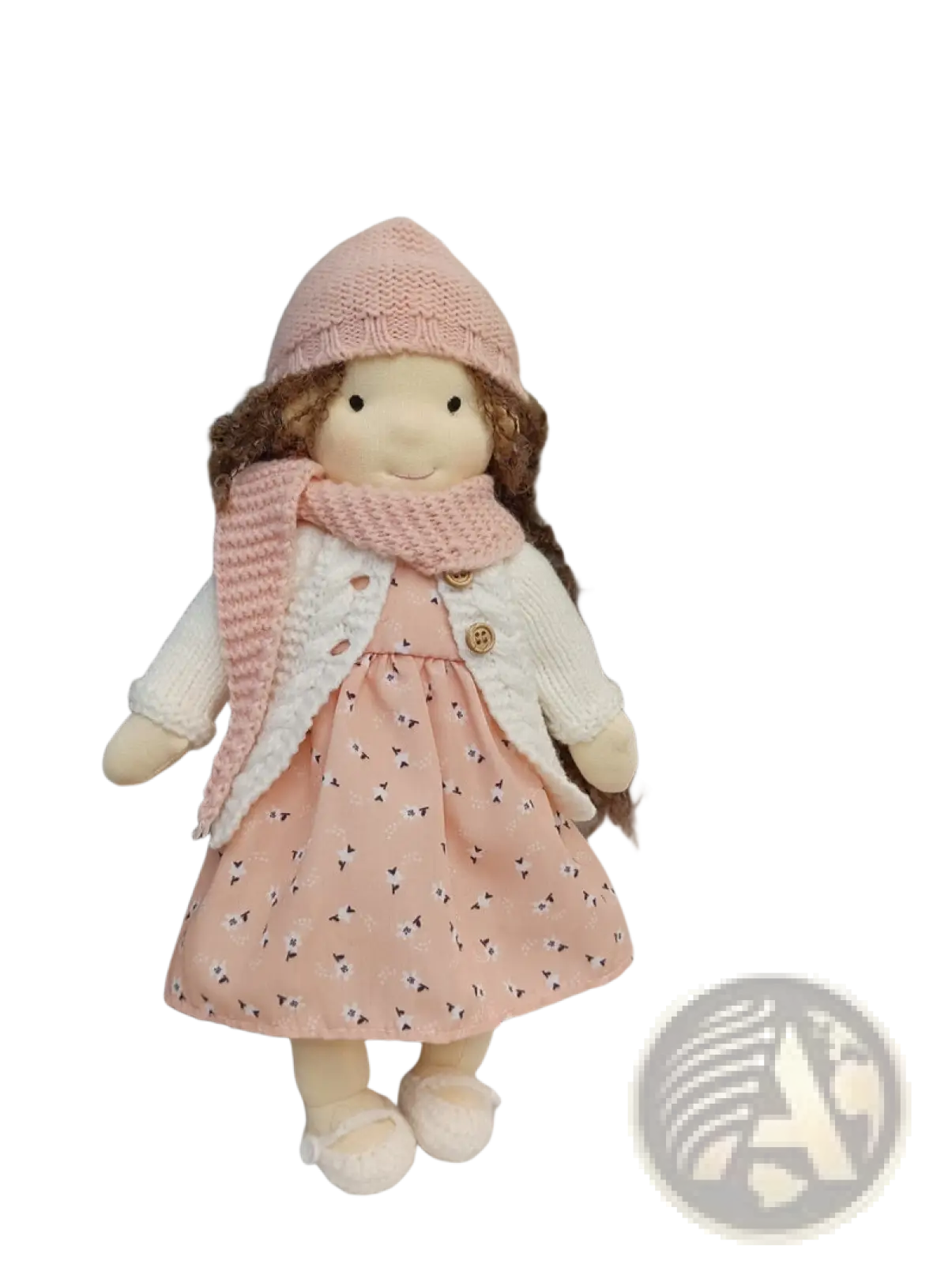 Handmade plush doll with golden curly hair wearing a soft pink knitted hat and matching textured scarf