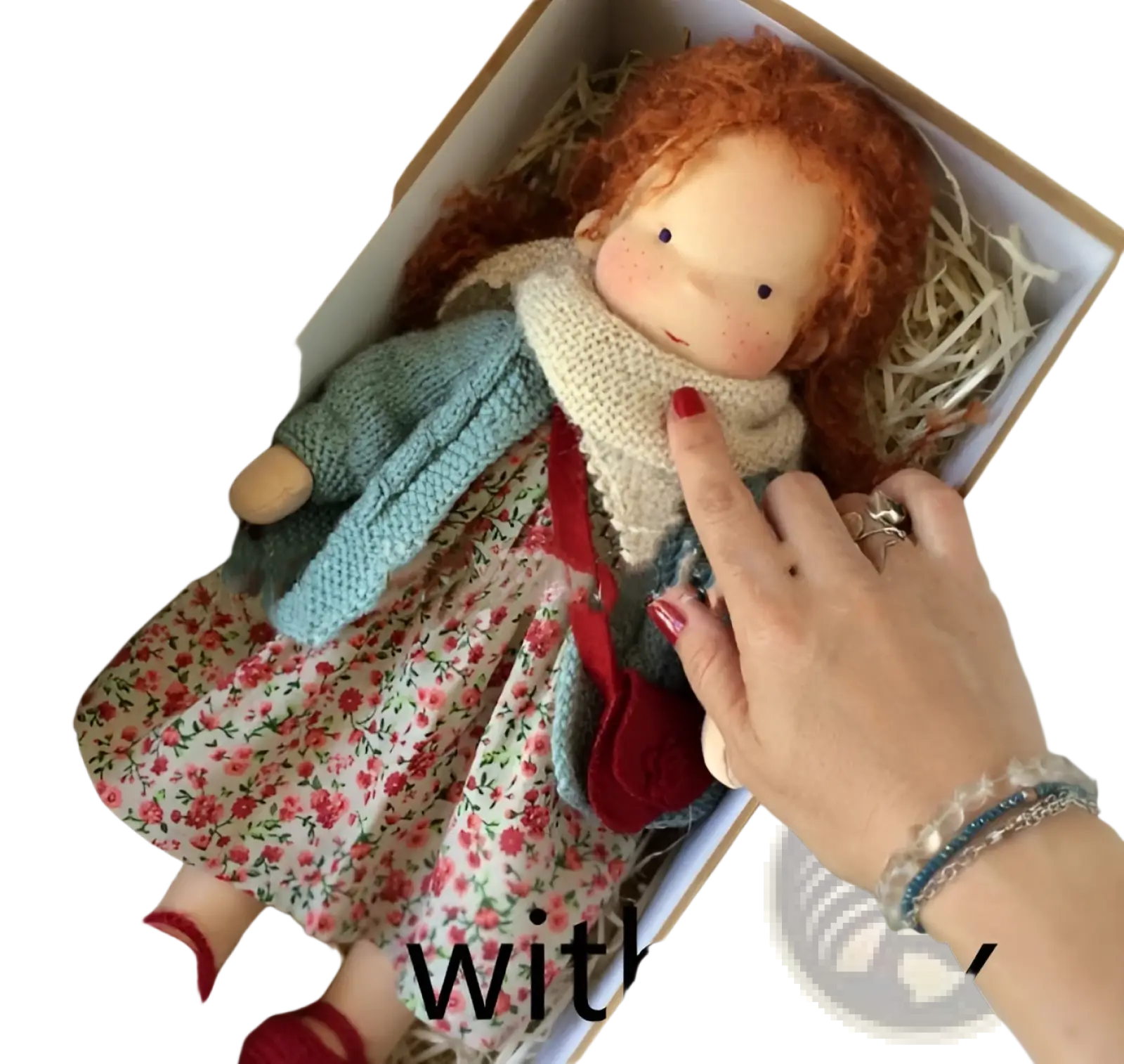 Handmade plush doll with golden curly red hair wearing floral dress and knitted sweater measuring 30cm