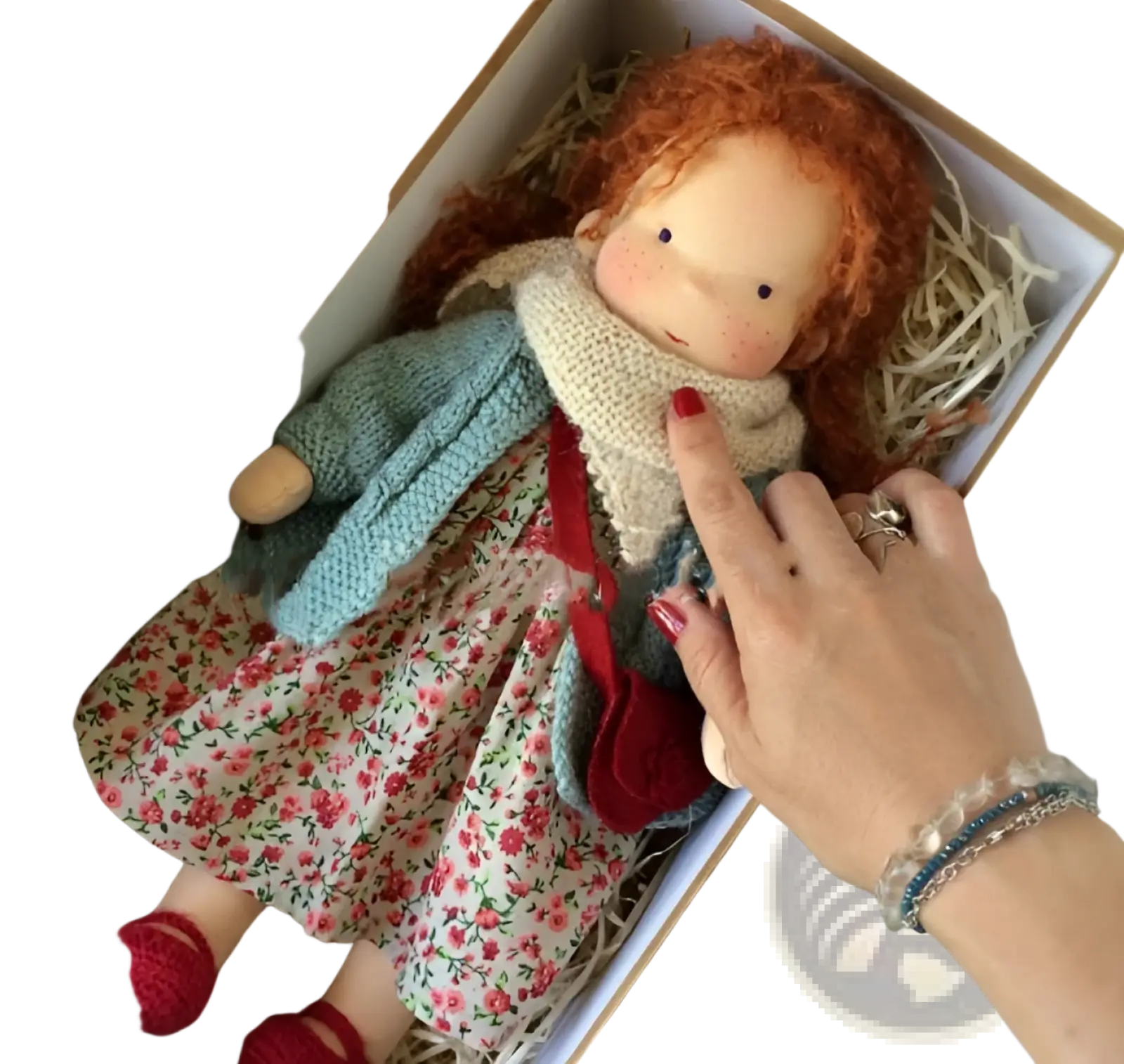 Handmade plush doll with curly red hair wearing a floral dress and light blue knitted cardigan 30cm tall