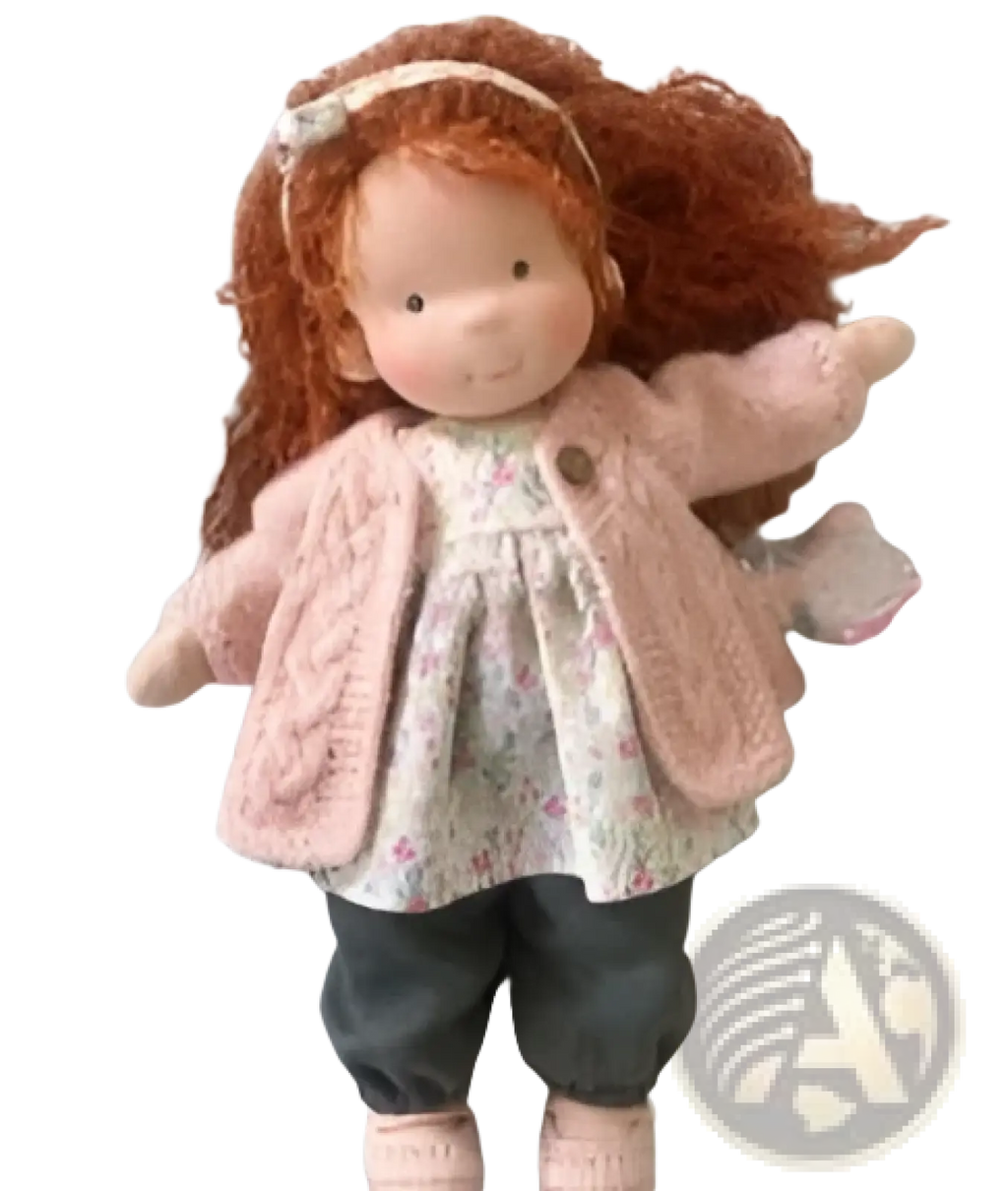 Handmade plush doll with auburn hair wearing pink knitted cardigan floral dress and dark gray pants 30cm tall