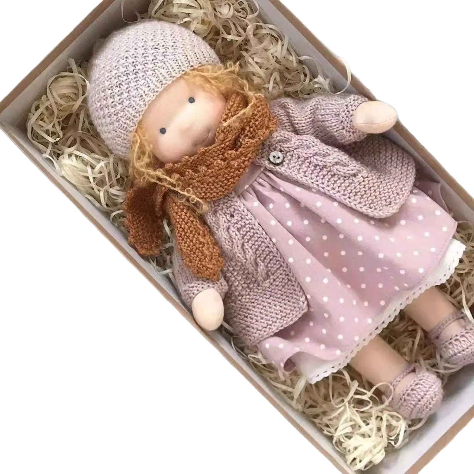 Handmade plush doll with golden curly hair wearing a soft pink knitted hat scarf polka-dotted dress and cozy cardigan