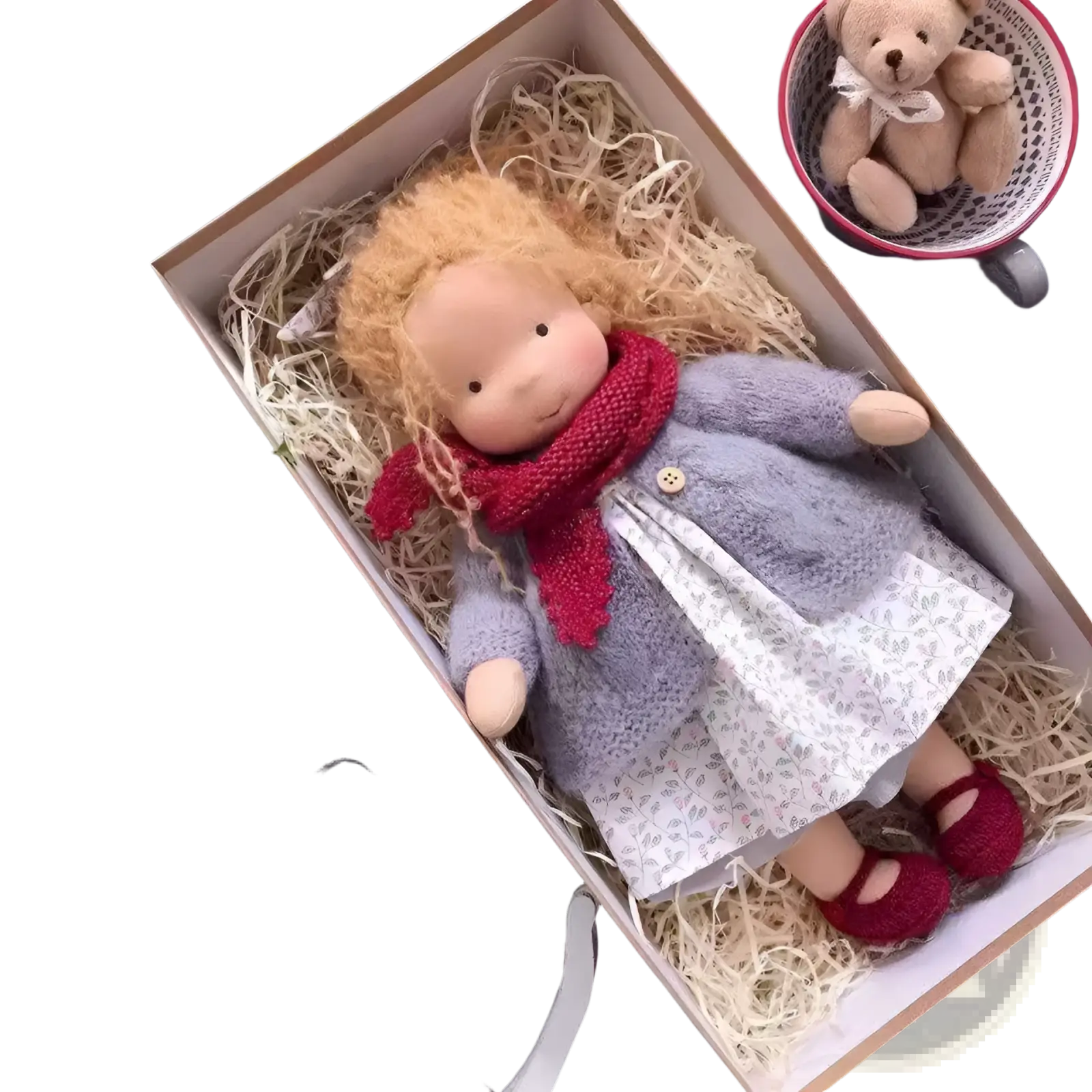 Handmade plush doll with golden curly hair wearing a gray knitted coat and red scarf over a white floral dress