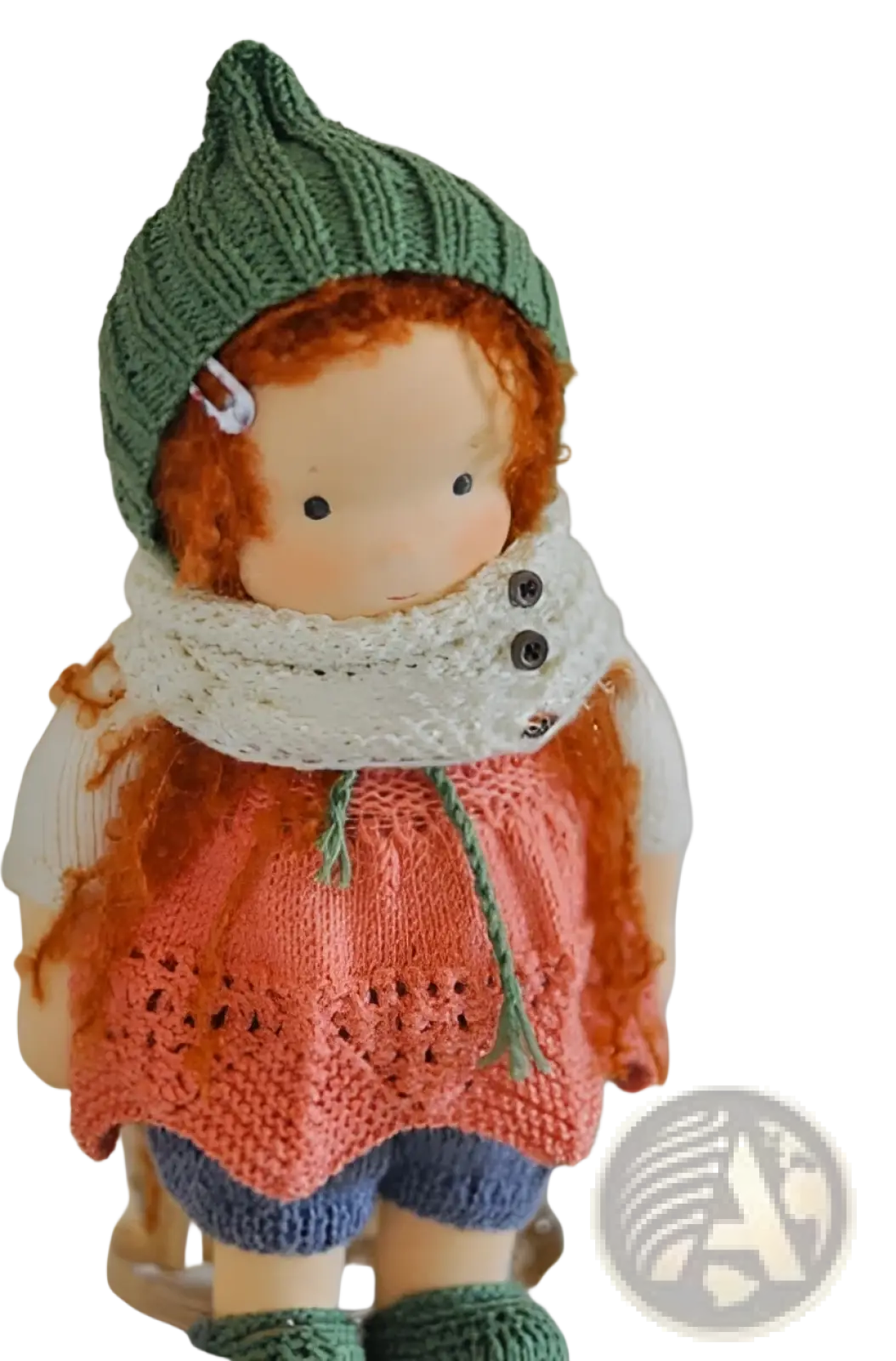 Handmade plush doll with golden curly hair featuring reddish-orange yarn hair green hat scarf orange sweater and blue shorts