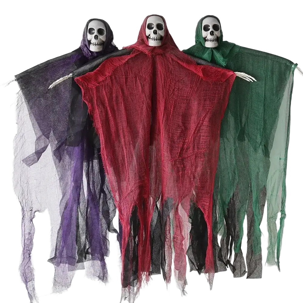 Three hanging skeleton ghost halloween decorations with skull faces and tattered fabric capes in purple red and green