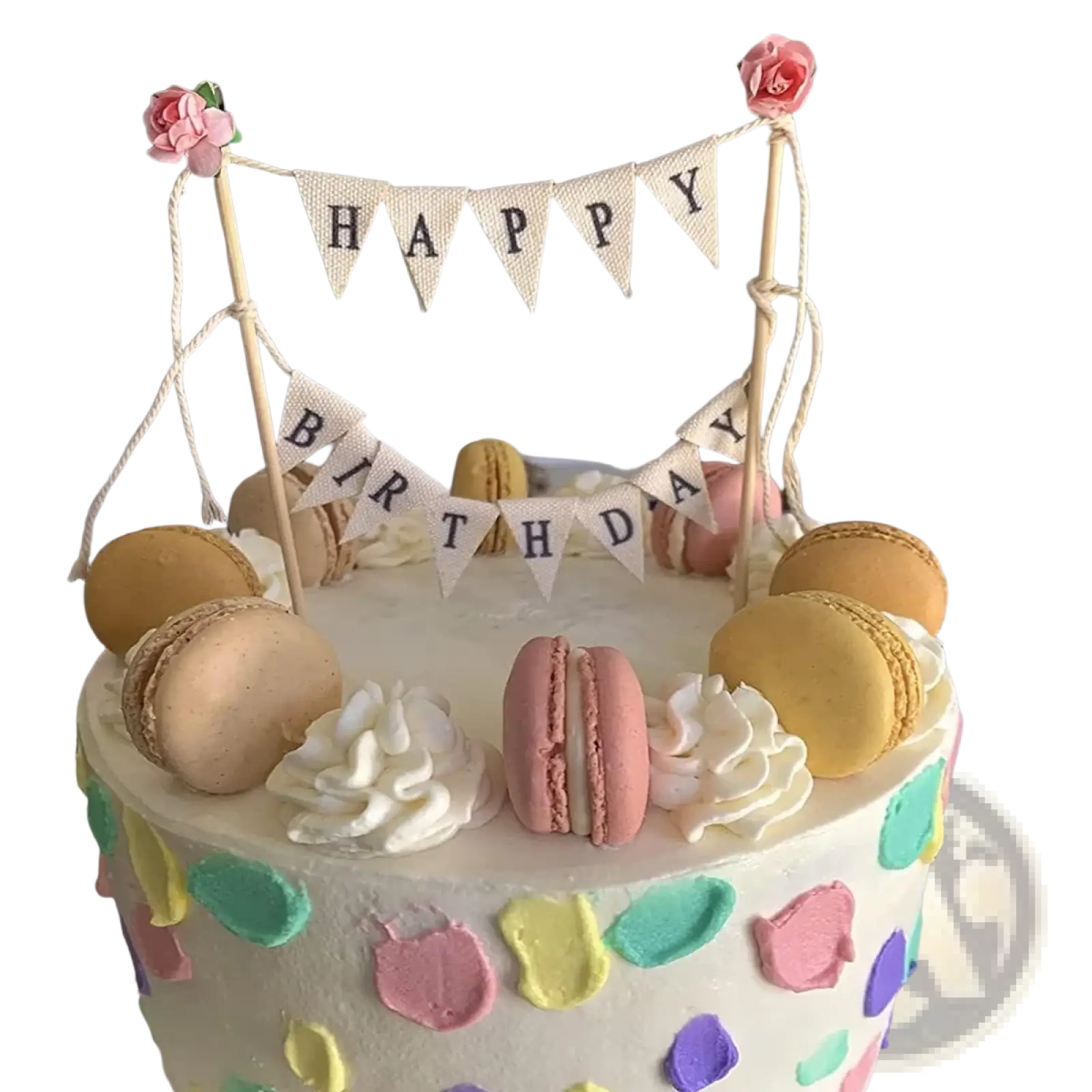 A pastel happy birthday cake with colorful macarons white frosting swirls and a bunting topper with pink roses