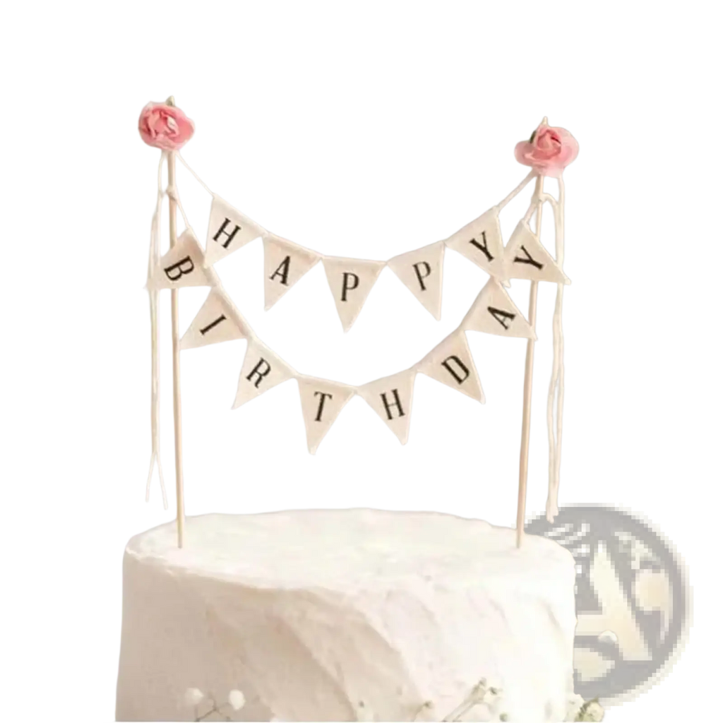 Happy birthday cake bunting topper in cream with black lettering and pink fabric roses for cake decoration