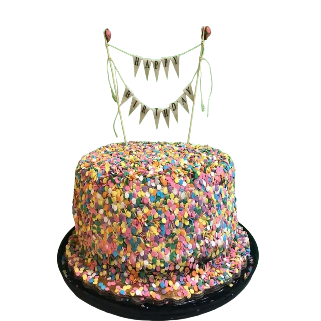 A round happy birthday cake with colorful confetti and a pink rose bunting topper for birthday celebrations
